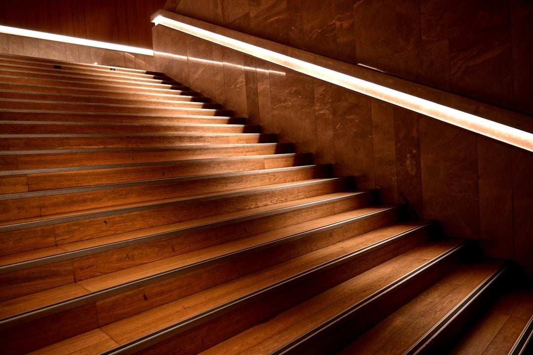Wooden staircase with modern lighting