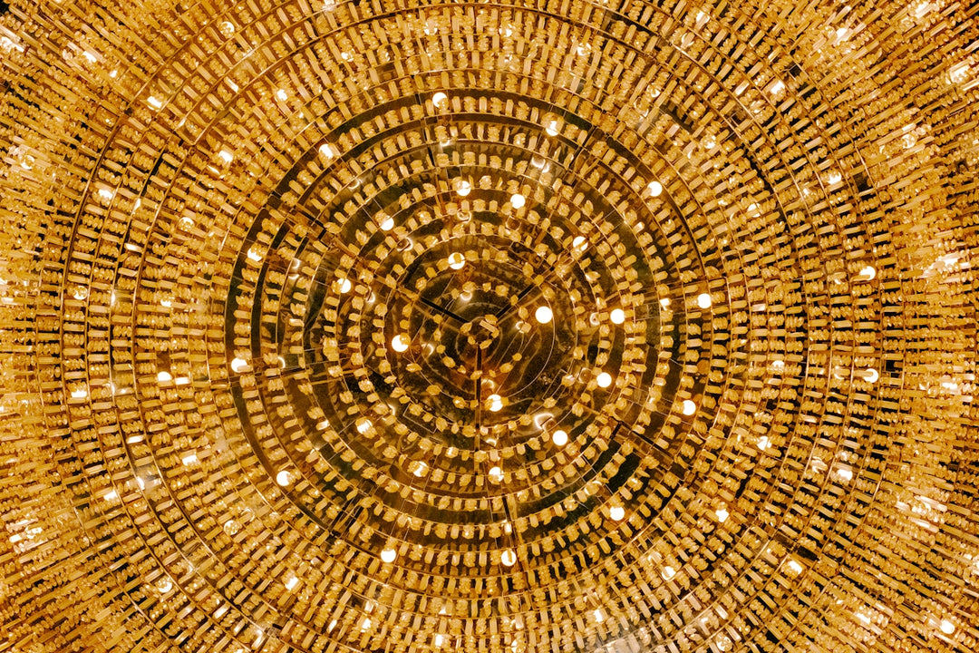 Circular pattern of glowing lights on a chandelier