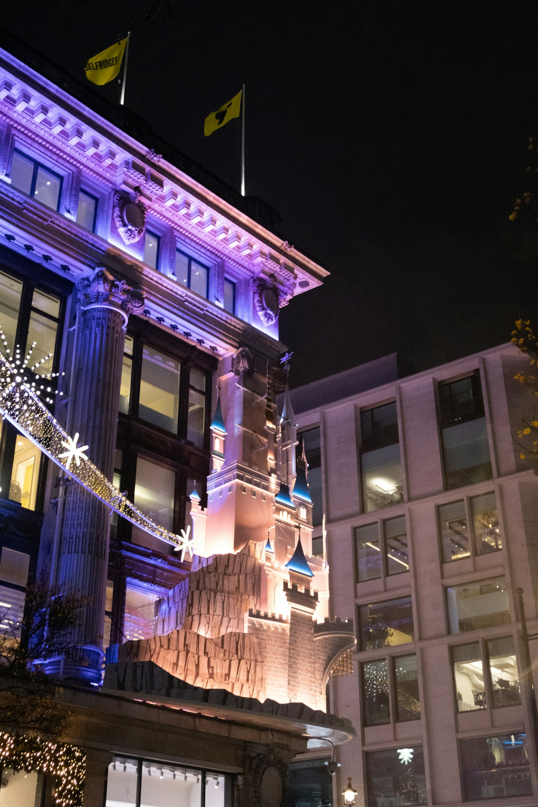 Building facade decorated with fairy tale castle and lights