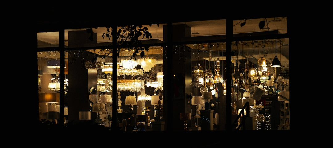 Window display of lamps at night