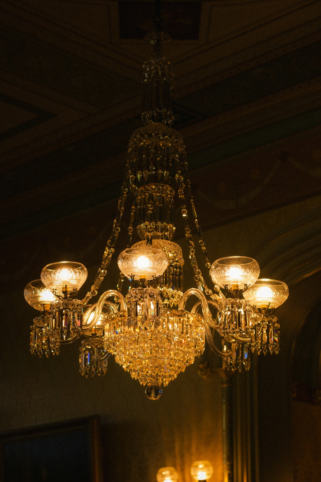 An ornate crystal chandelier with glowing lights